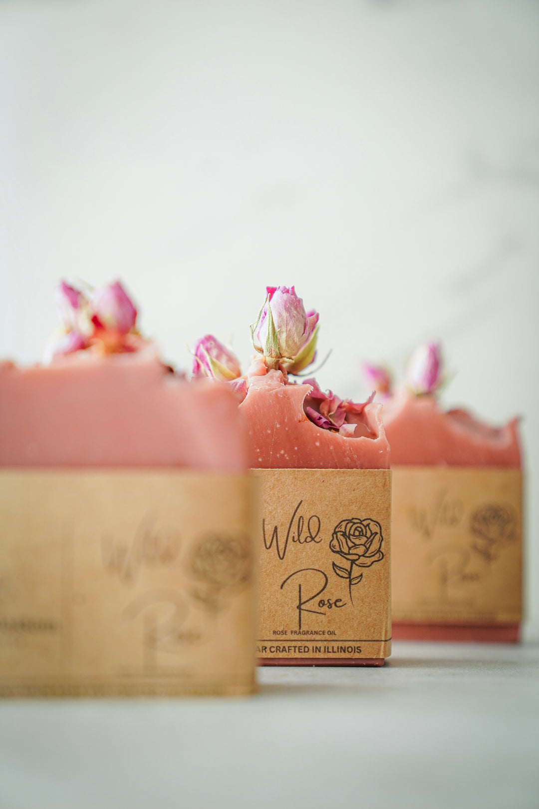 Wild Rose bar soap with fresh rose petals and buds, handcrafted pink soap bars by Orange Blossom Collective