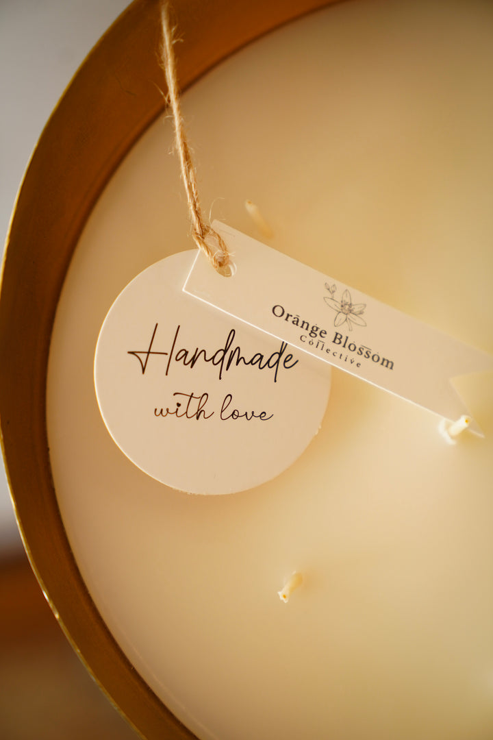 Handmade with love tag on Orange Blossom Collective candle, close-up