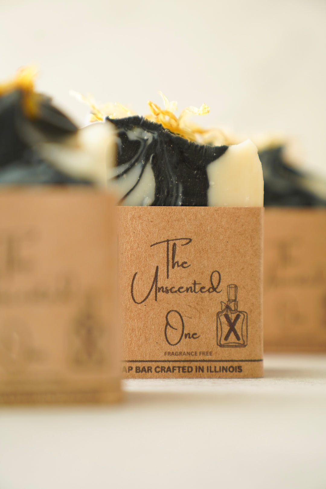 The Unscented One bar soap wrapped in kraft paper packaging, handcrafted by Orange Blossom Collective in Illinois