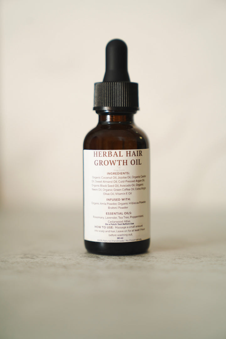 Herbal Hair Growth Oil amber dropper bottle with ingredient label, front view