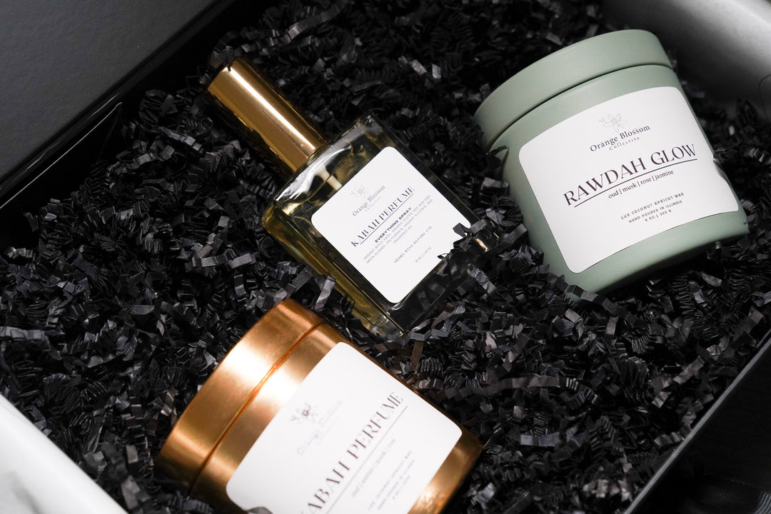 Rawdah Glow candle sage green tin and Kabah Perfume Everything Spray close up Orange Blossom Collective Illinois
