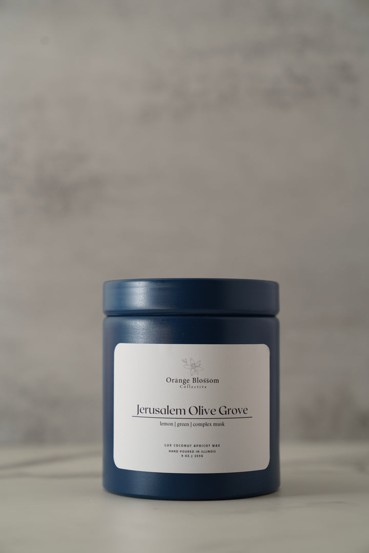 Jerusalem Olive Grove candle 9oz blue tin angle view non-toxic coconut apricot wax Orange Blossom Collective Illinois