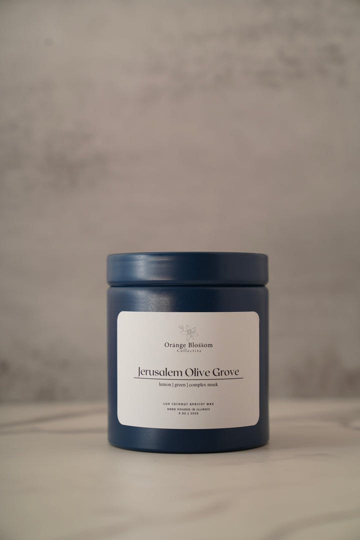 Jerusalem Olive Grove candle 9oz blue tin front view lemon green complex musk scent OBC handmade Illinois